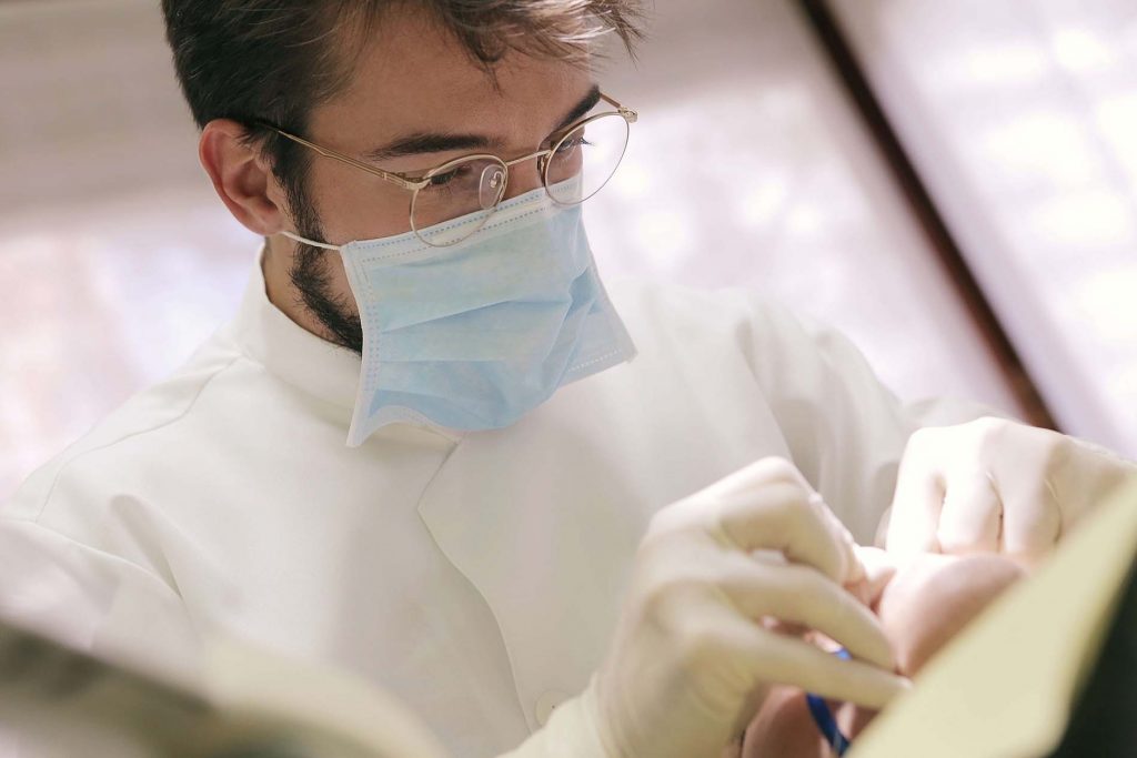 dentist fixing teeth